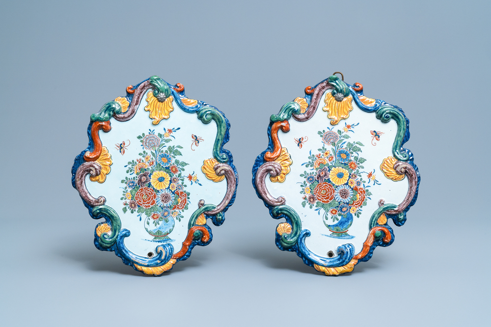 A pair of fine polychrome Dutch Delft plaques with still lifes of flowers in a vase, 18th C.