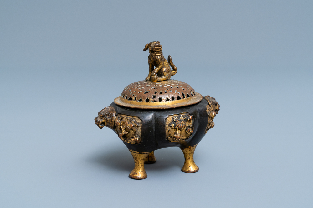 A Chinese lacquered and parcel-gilt bronze tripod censer and cover, Ming
