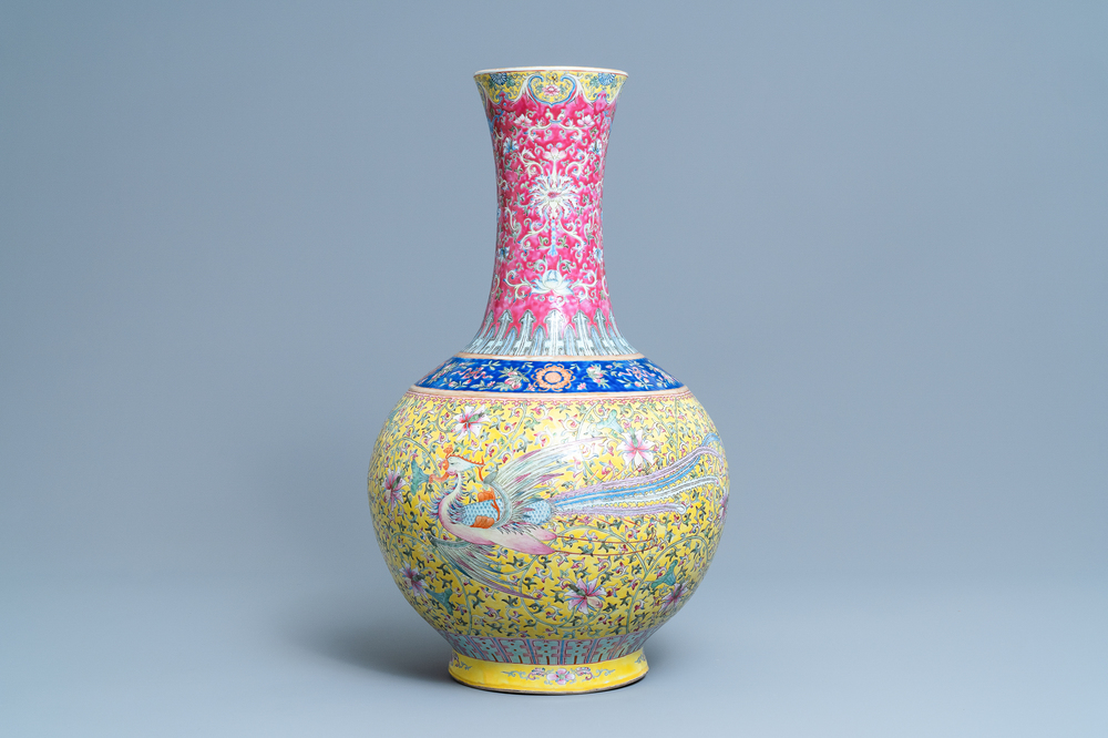 A large Chinese yellow-ground famille rose 'dragon and phoenix' bottle vase, 19th C.