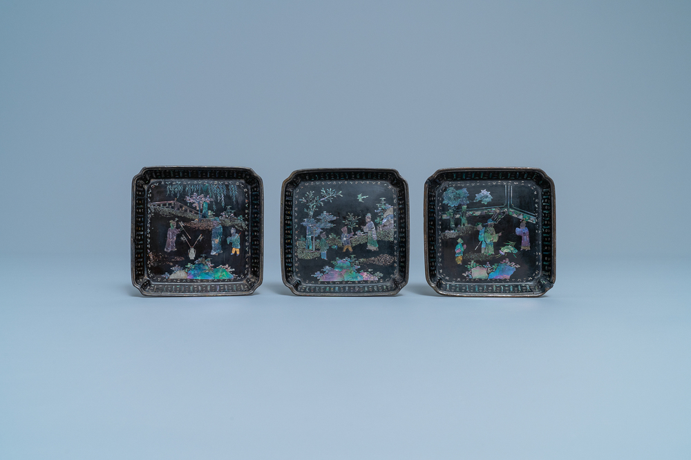 Three square Chinese lac burgaut&eacute; saucers, marked, Kangxi