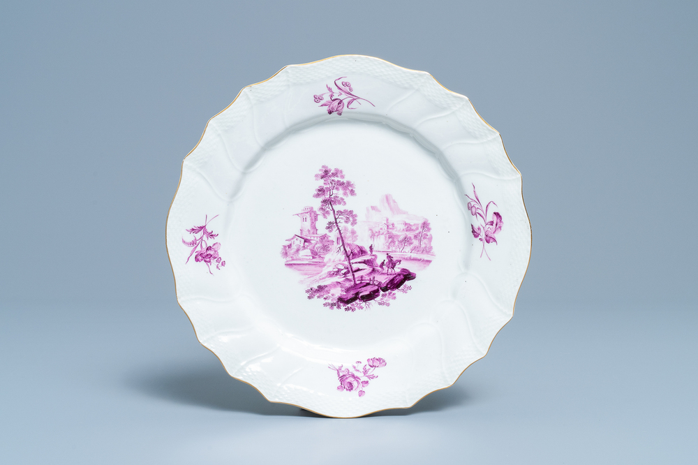 Une assiette en porcelaine de Tournai &agrave; d&eacute;cor d'un paysage en cama&iuml;eu pourpre, 18&egrave;me