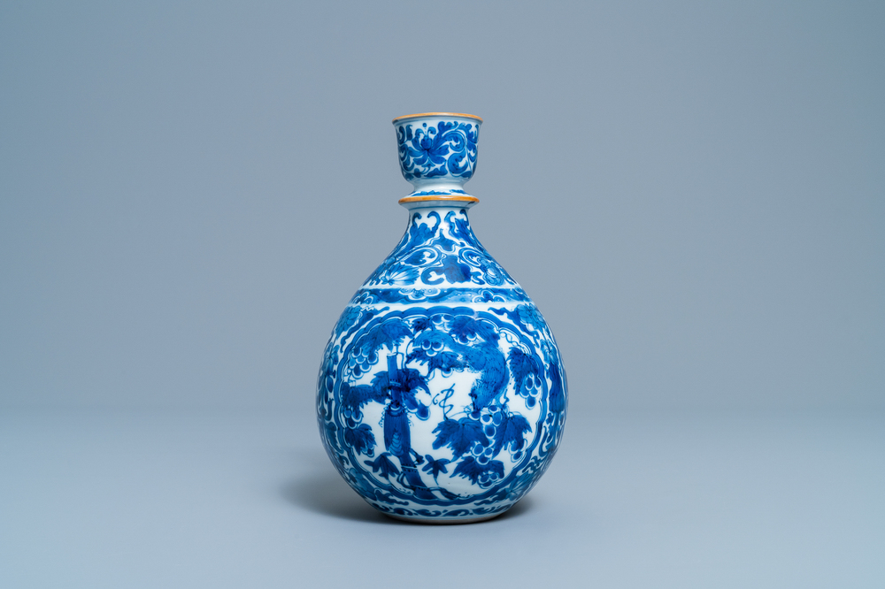 A Chinese blue and white 'squirrel and grapevine' huqqa base, Kangxi