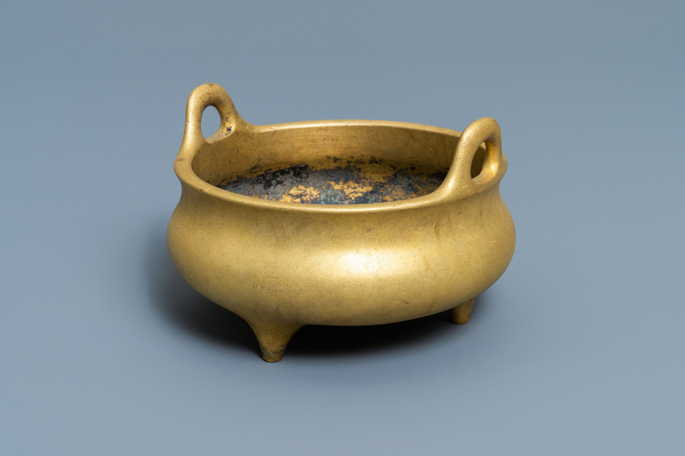 A Chinese gilt bronze tripod censer, Xuande mark, 19/20th C.