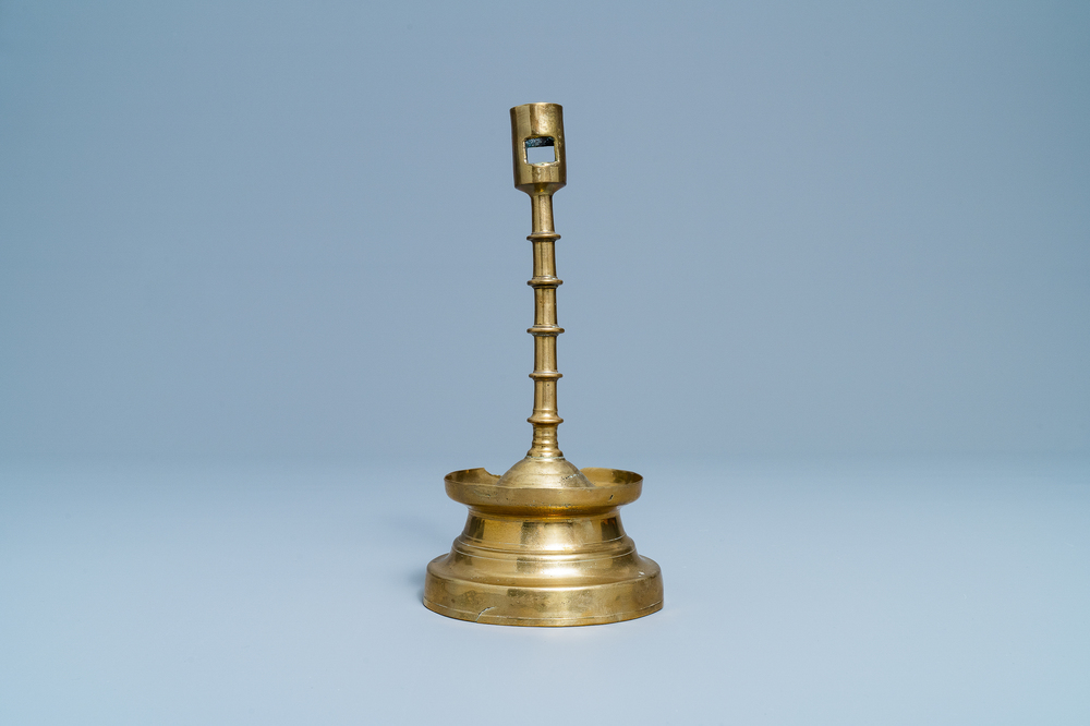 A Flemish or Dutch knotted bronze candlestick, 15th C.