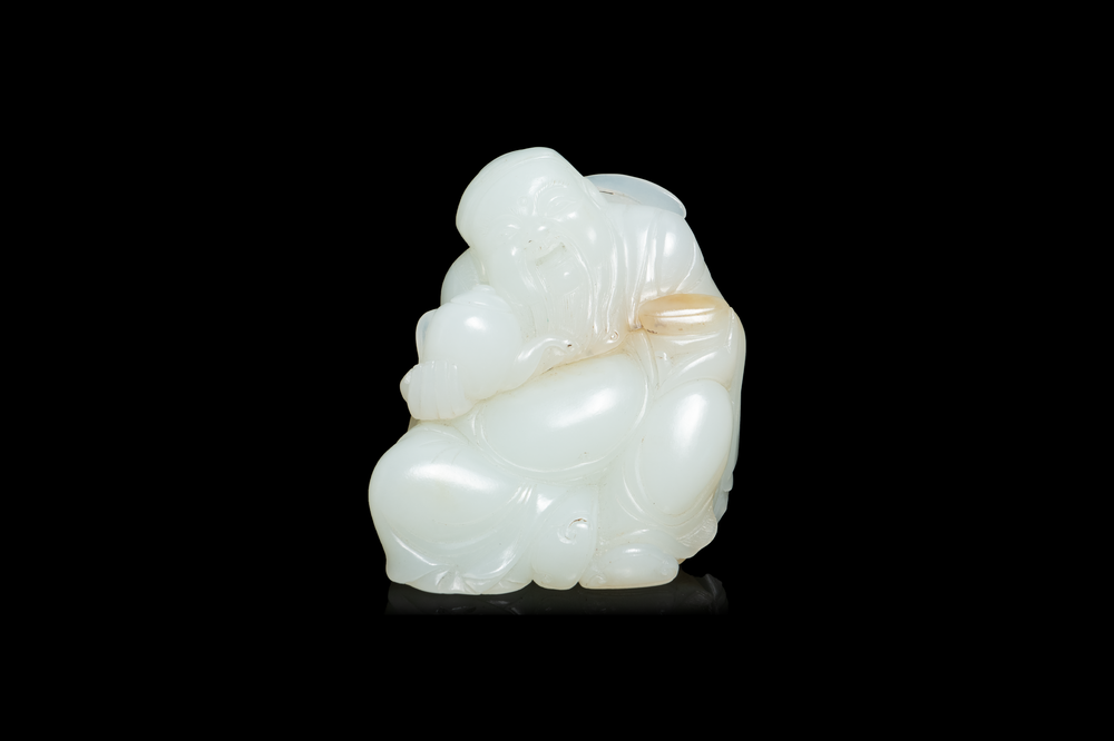 A Chinese white jade figure of Li Taipo, Kangxi/Yongzheng