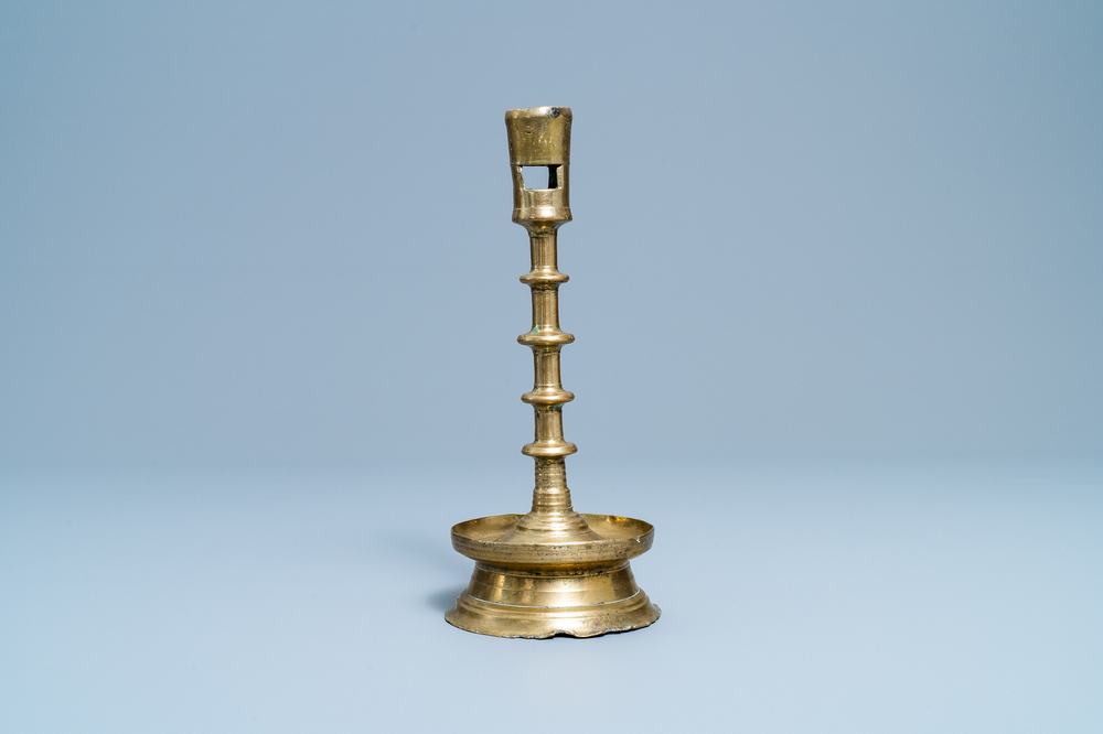 A Flemish or Dutch knotted bronze candlestick, 15th C.