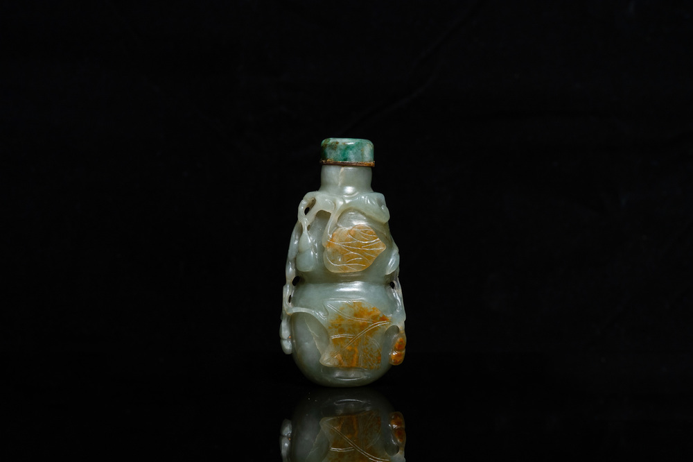 A Chinese gourd-shaped celadon and russet jade snuff bottle, Qing