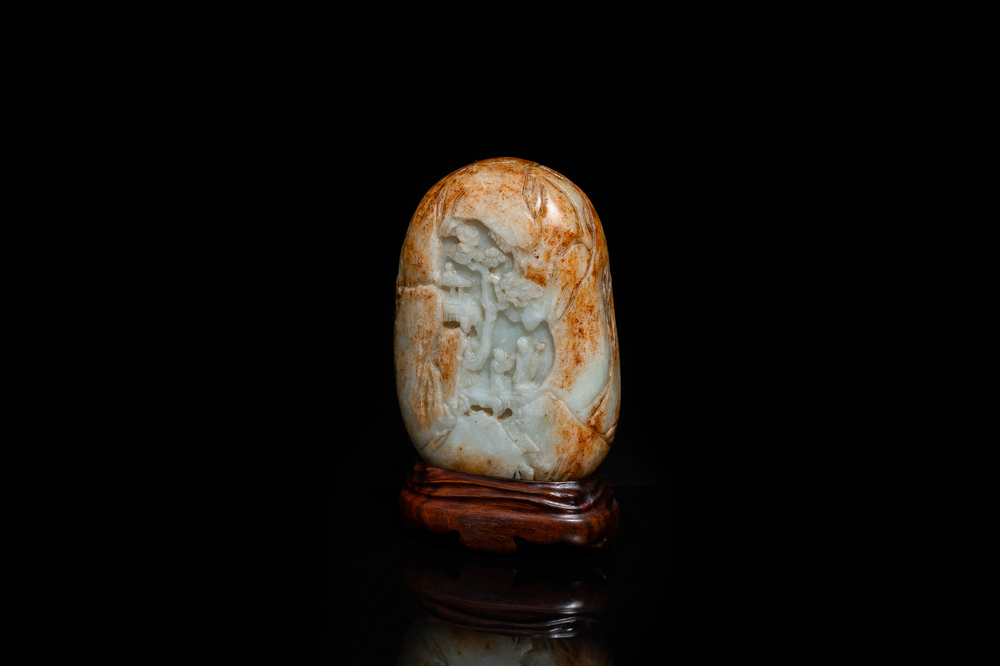 A Chinese celadon and russet jade boulder carving, Qing