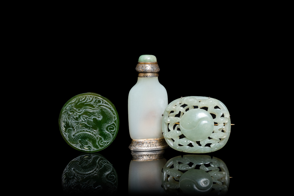 A Chinese white jade snuff bottle and two green jade carvings, 17th C. and later