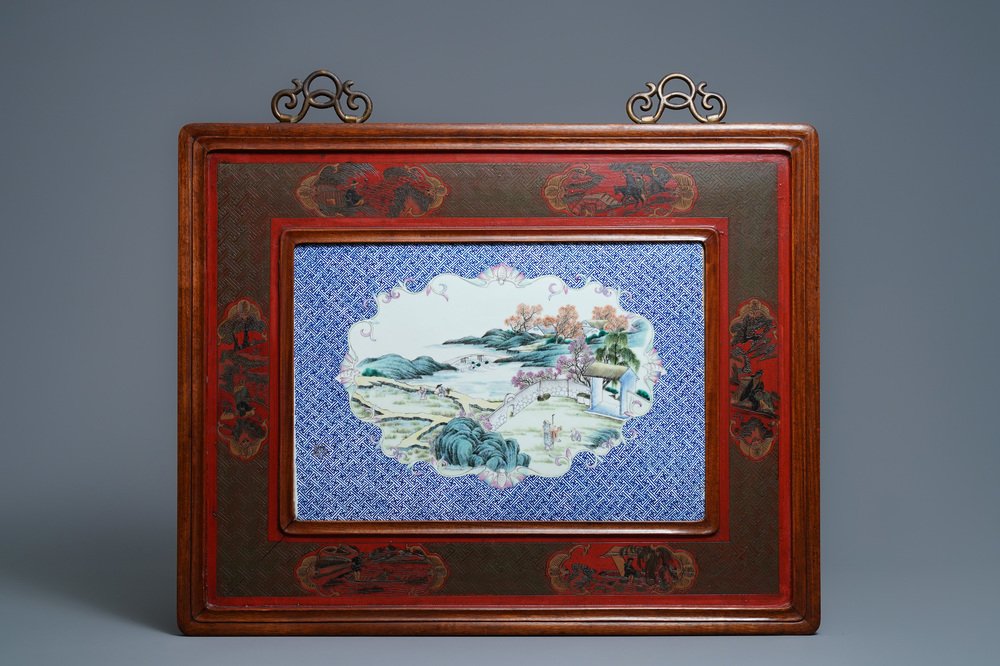 A large Chinese famille rose plaque in a lacquered wooden frame, 19th C.