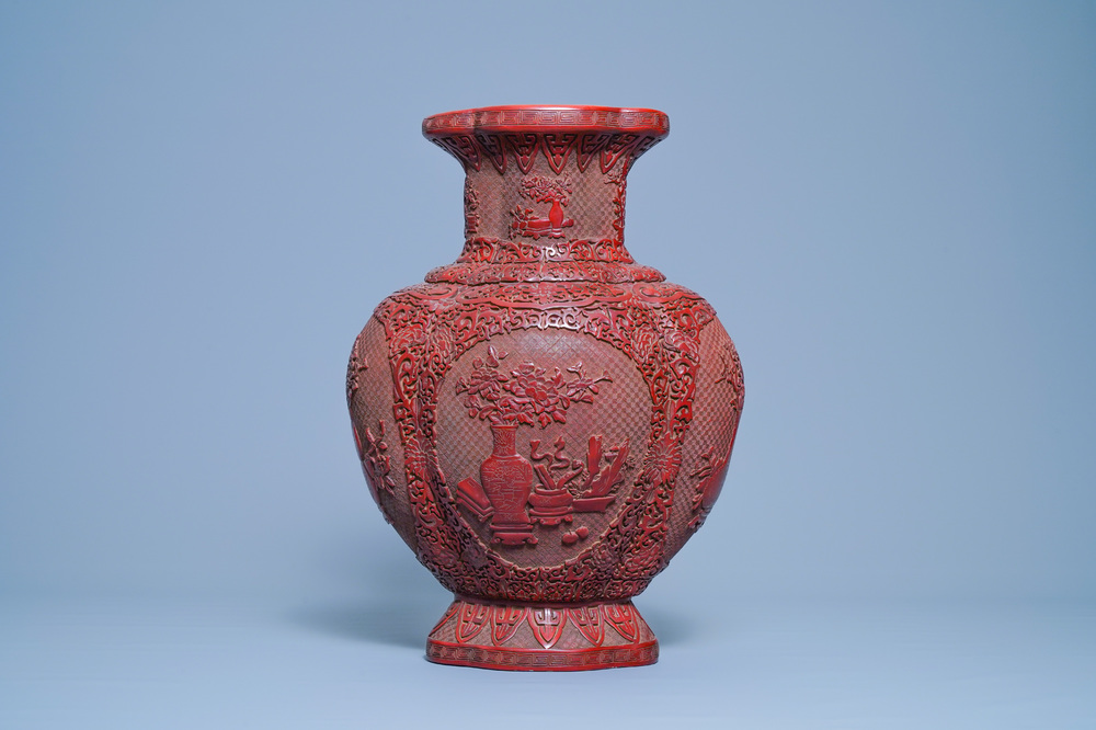 A Chinese carved red lacquer vase, Qianlong mark, 19/20th C.