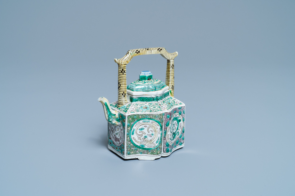 A Chinese verte biscuit teapot and cover, Kangxi