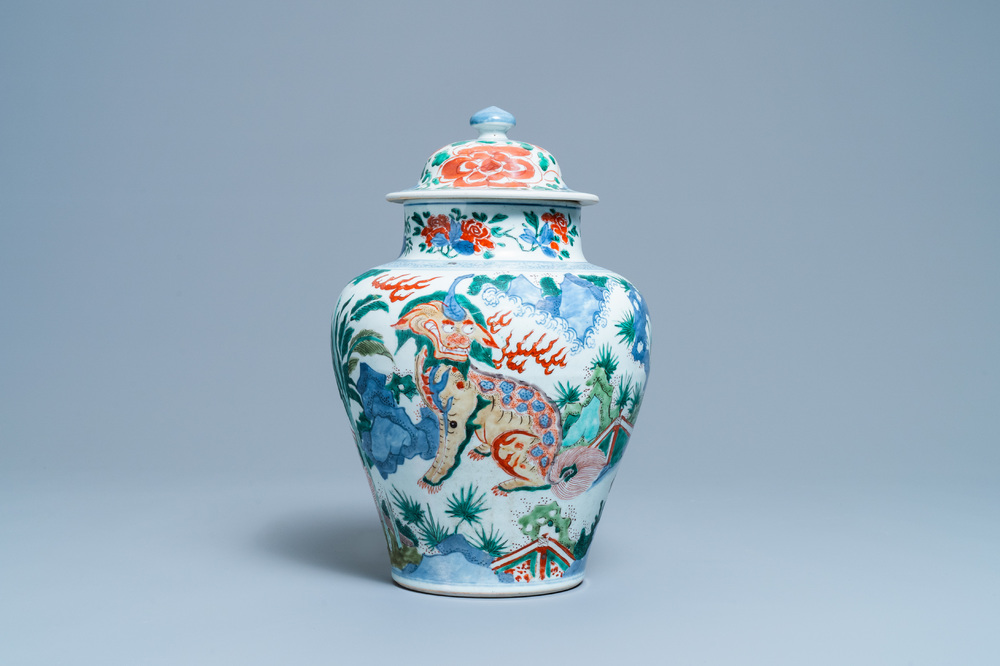 A Chinese wucai 'mythical beasts' vase and cover, Transitional period