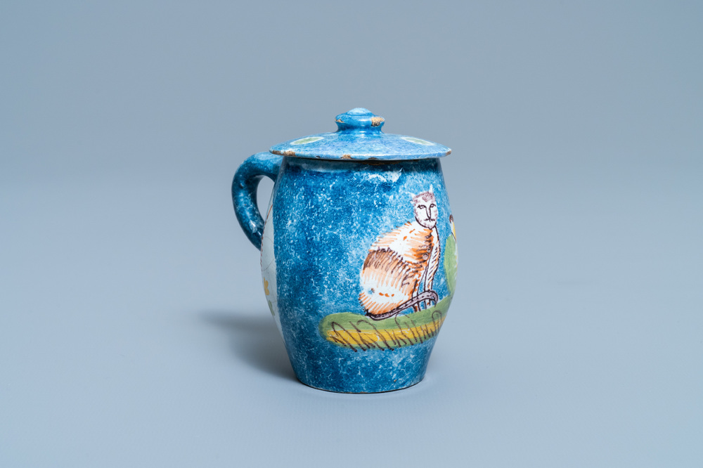 A polychrome Brussels faience mustard jar and cover with a cat, 18th C.