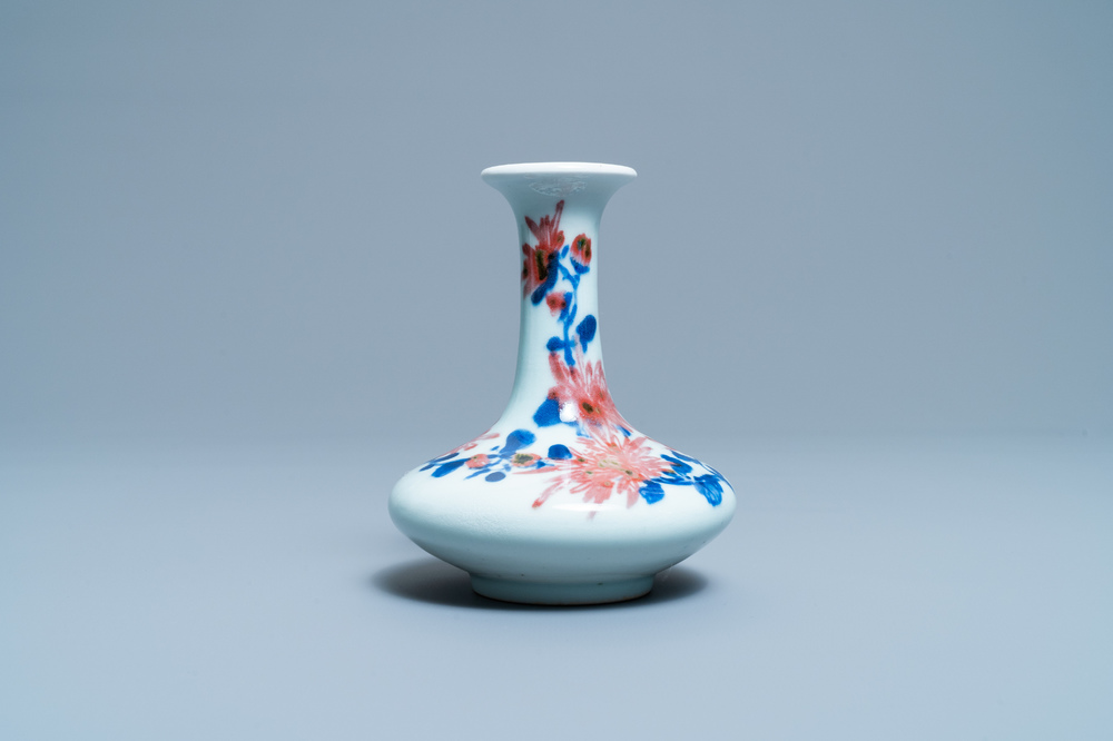 A small Chinese blue, white and underglaze red bottle vase with floral design, Republic