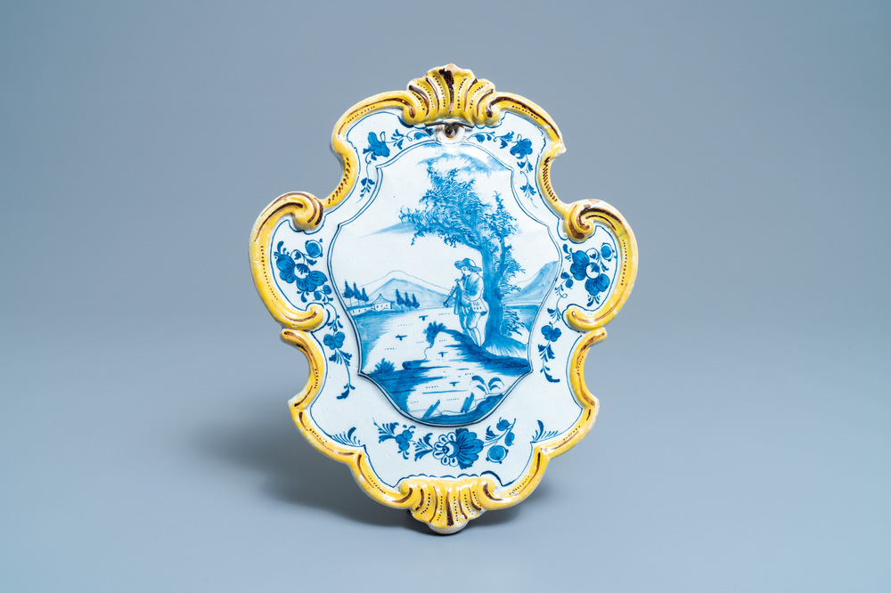 A Dutch Delft mixed technique 'flute player' plaque, 18th C.