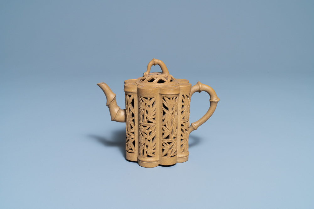 A Chinese reticulated Yixing stoneware teapot and cover, Kangxi