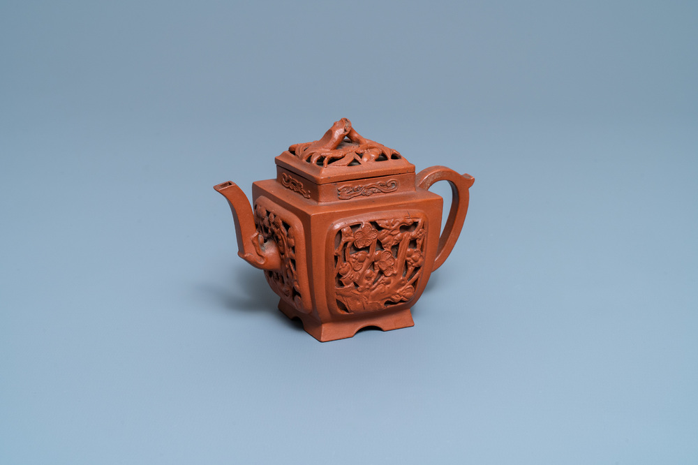 A Chinese reticulated Yixing stoneware teapot and cover, Kangxi