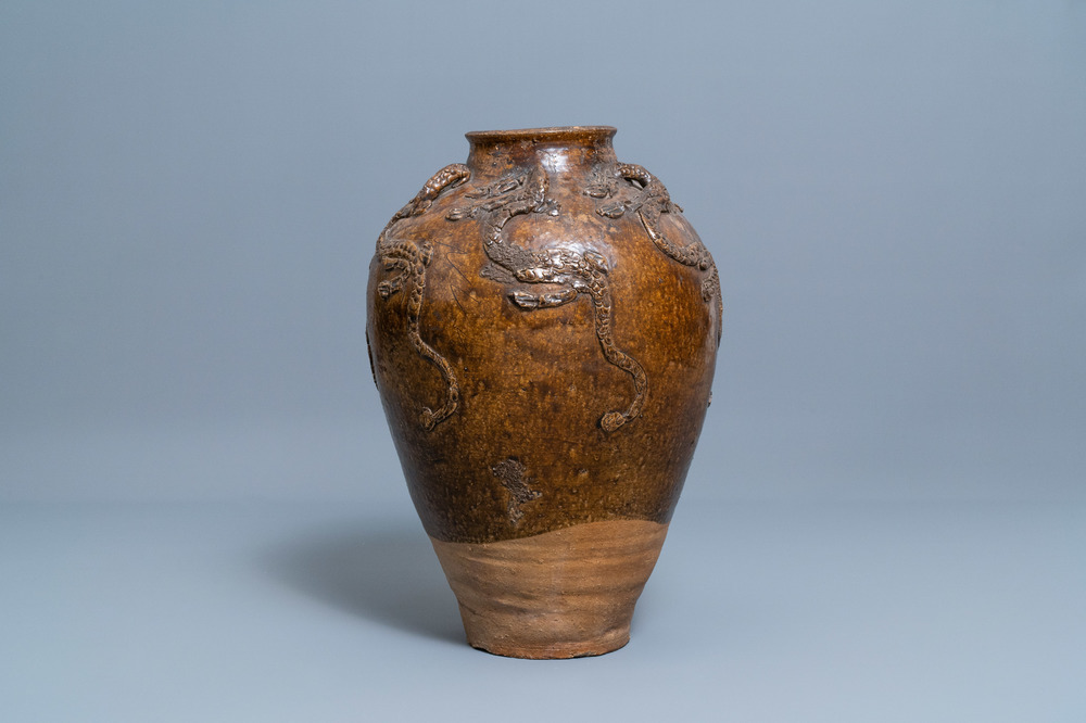 A large Chinese brown-glazed relief-molded martaban jar with dragons, Qing