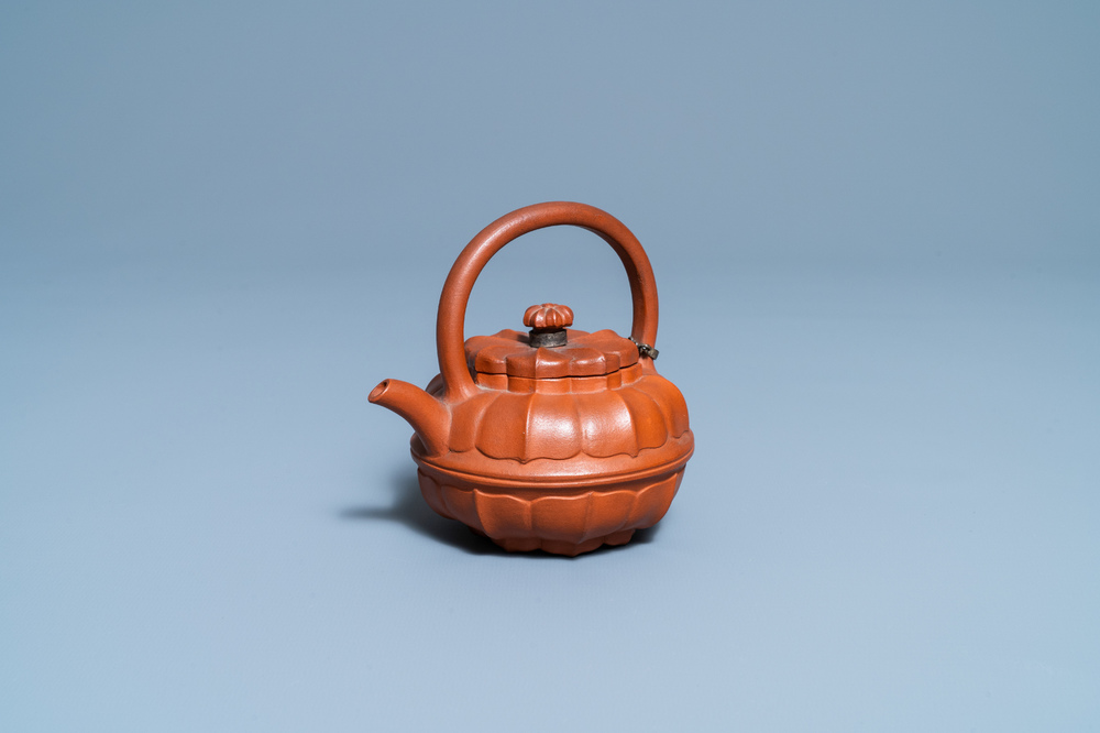 A Chinese Yixing stoneware chrysanthemum-shaped teapot and cover, Yongzheng/Qianlong