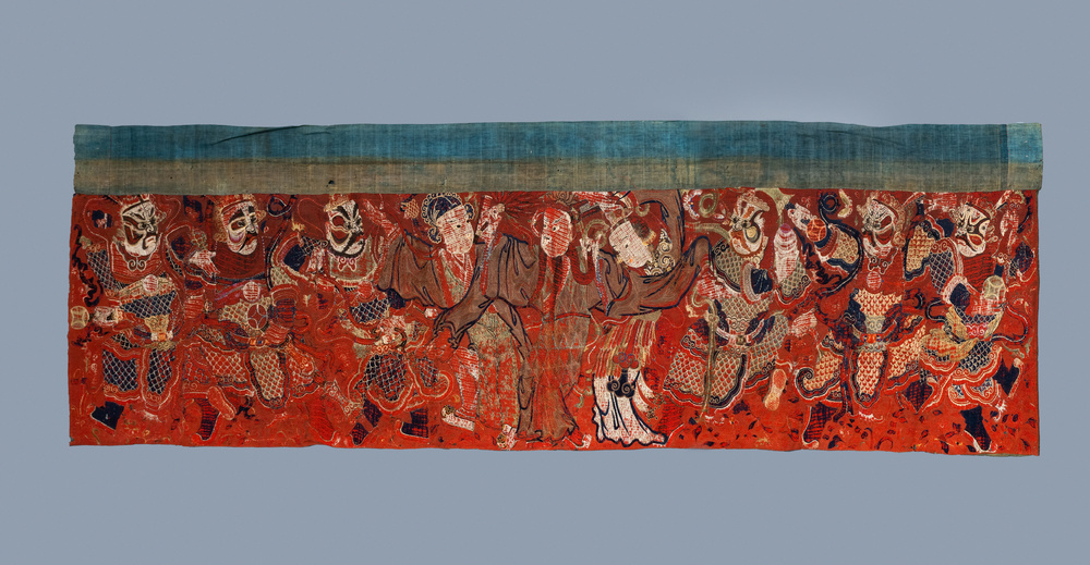 A large Chinese horizontal embroidered red-ground textile panel, 19th C.