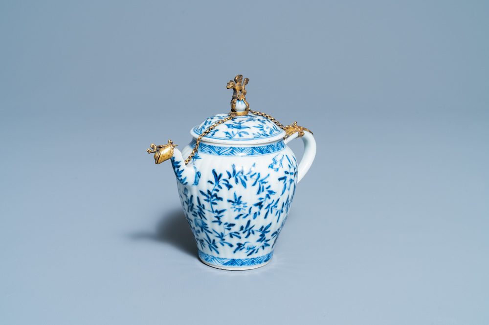 A Chinese gilt-mounted blue and white teapot and cover, Kangxi