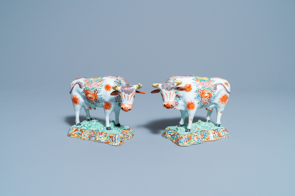 A pair of polychrome petit feu and gilded Dutch Delft models of cows, 1st half 18th C.