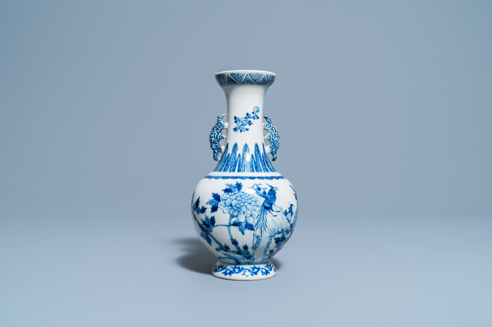 A Chinese blue and white vase with a bird among blossoms, Qianlong mark, 19th C.