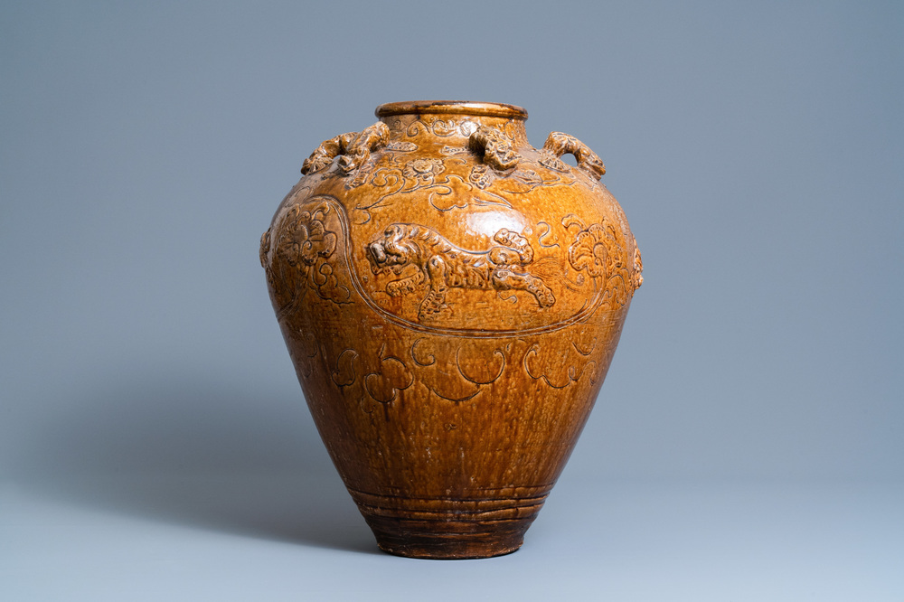 A large Chinese brown-glazed relief-molded martaban jar with Buddhist lions, Ming