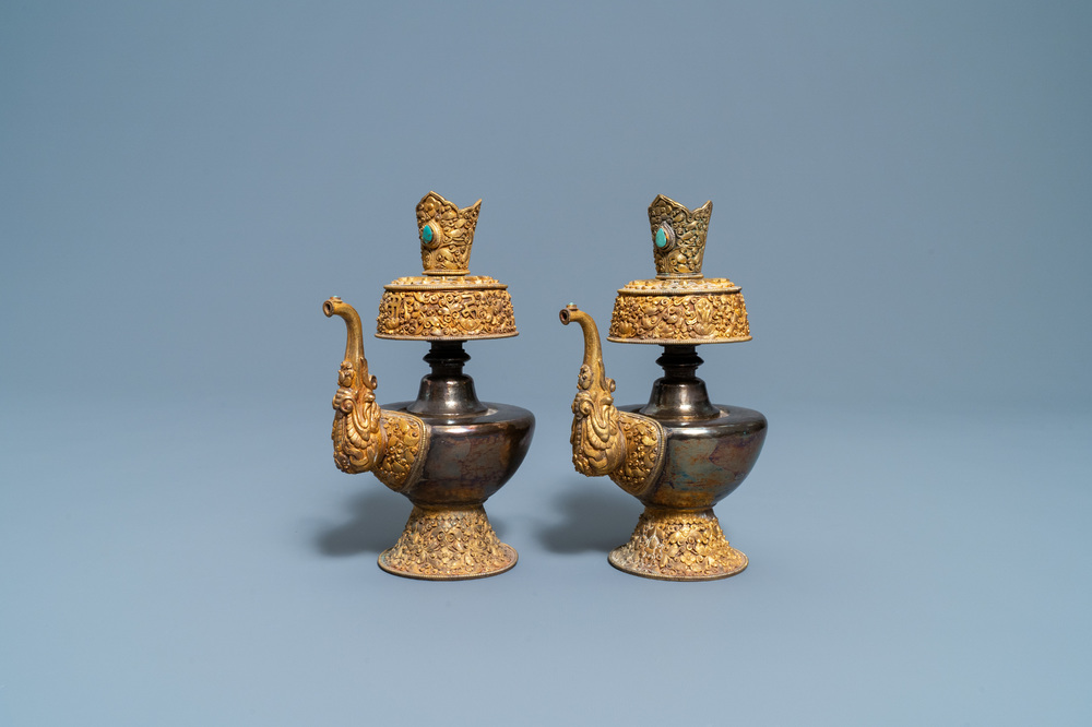 A pair of Tibetan silver and gilt copper alloy 'duomuhu' ewers, 19th C.