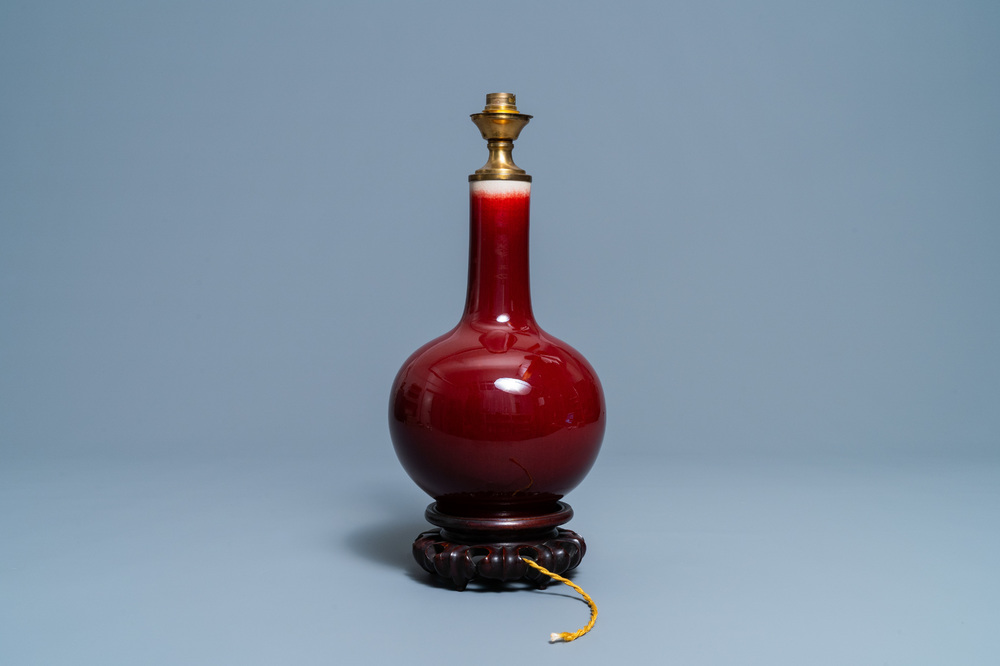 A Chinese monochrome sang de boeuf lamp-mounted bottle vase, 19/20th C.