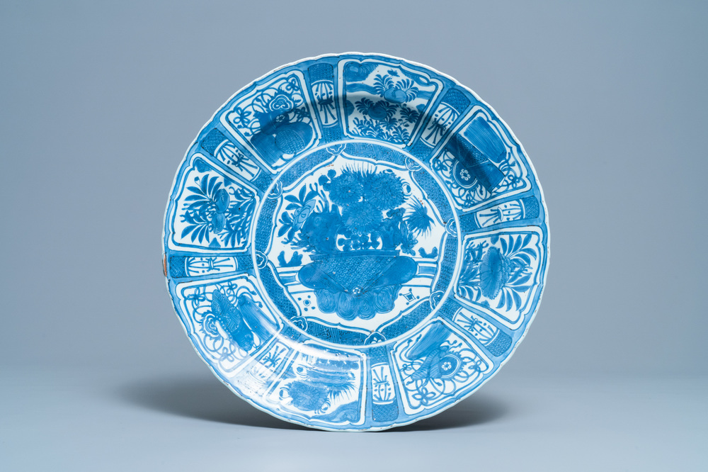 A very large Chinese blue and white kraak porcelain charger with a flower basket, Wanli