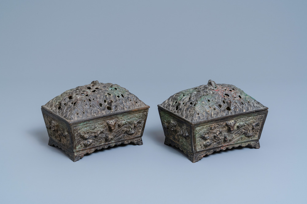 A pair of Chinese Ming-style bronze censers with reticulated covers, 19th C.