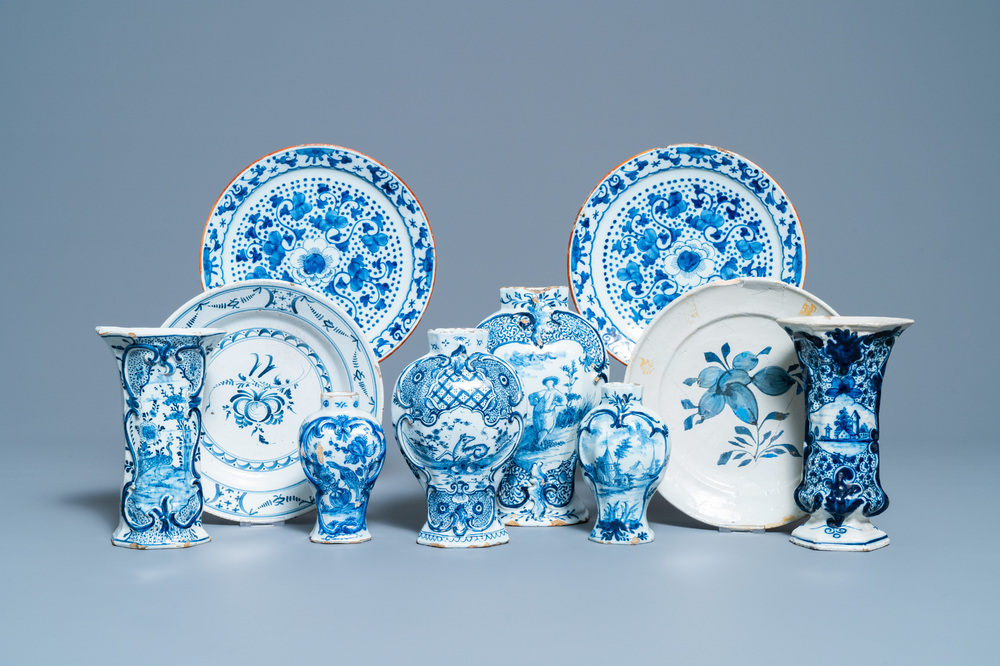 A varied collection of blue and white Dutch Delft plates and vases, 18th C.