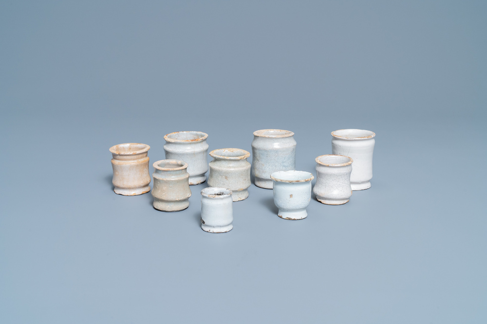 Nine white Dutch Delftware albarello-type ointment jars, 17/18th C.