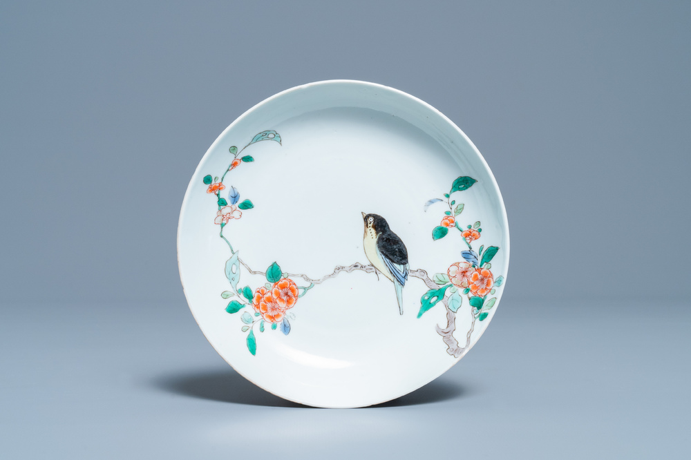 A Chinese famille verte saucer dish with a bird on a blossoming branch, Kangxi