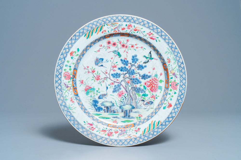 A large Chinese famille rose dish with birds among blossoming branches, Qianlong