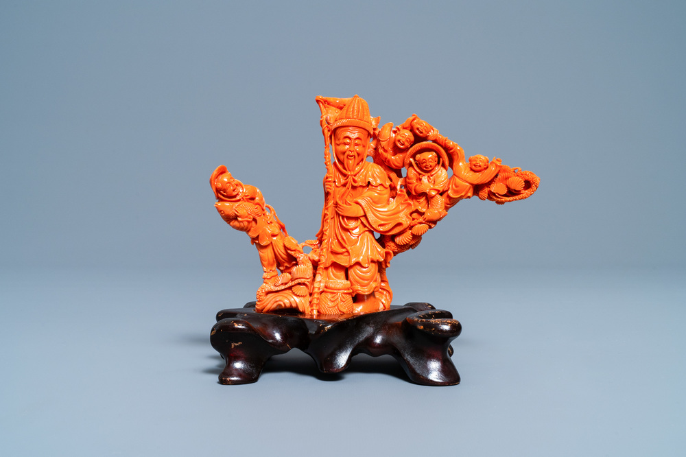 A Chinese carved red coral 'immortal' group, 19/20th C.