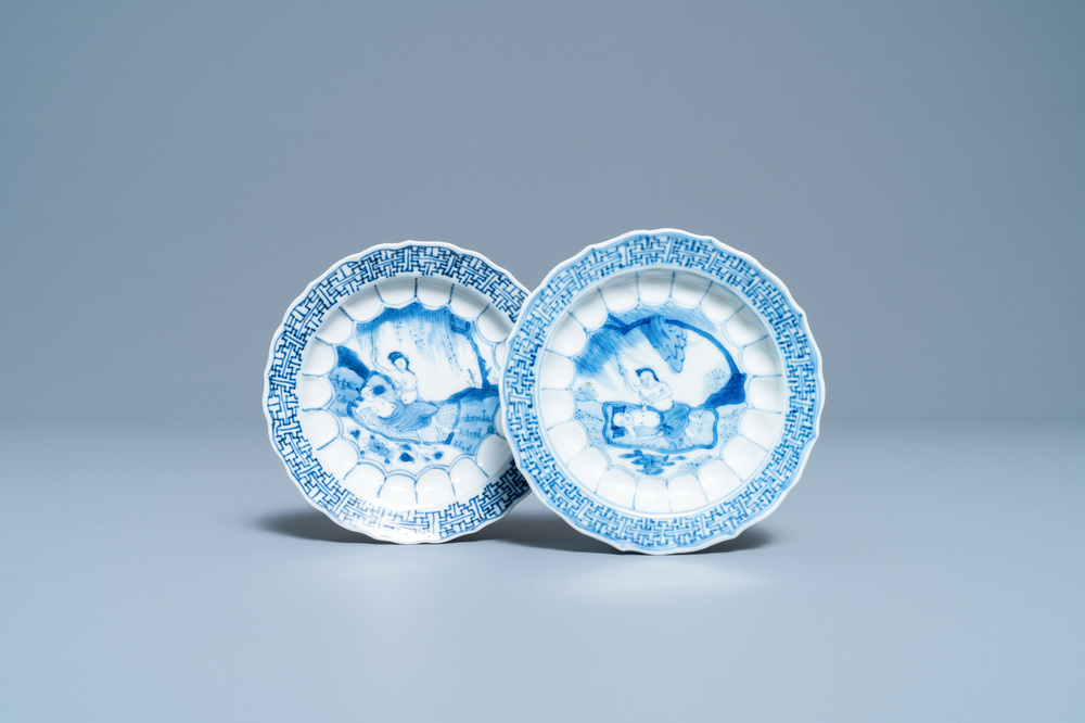 A pair of Chinese blue and white 'acupuncture' saucers, Kangxi
