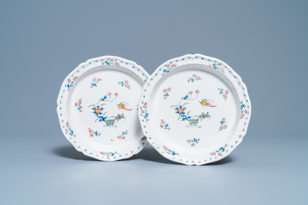 A pair of deep Brussels faience plates with '&agrave; la haie fleurie' design, 18th C.
