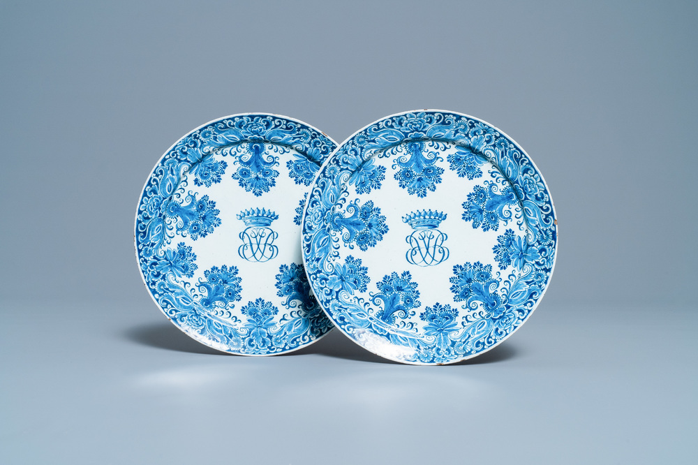 A pair of Dutch Delft blue and white plates with crowned monograms, 1st quarter 18th C.