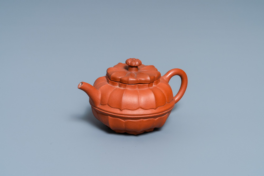 A Chinese Yixing stoneware chrysanthemum-shaped teapot and cover, Yongzheng/Qianlong