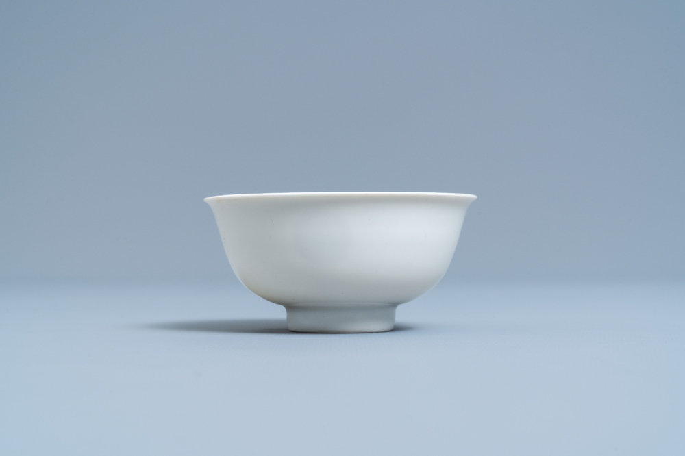 A Chinese monochrome white-glazed anhua-decorated 'dragon' bowl, Yongzheng mark and of the period