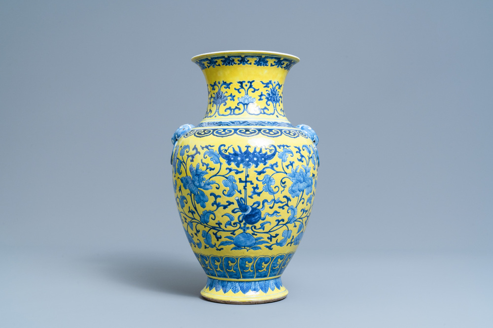 A Chinese blue and white yellow-ground vase with floral design, 19th C.