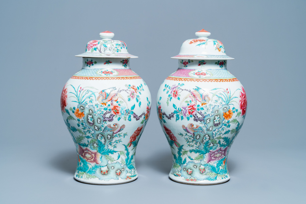 A pair of Chinese famille rose vases and covers, Qianlong mark, 19th C.