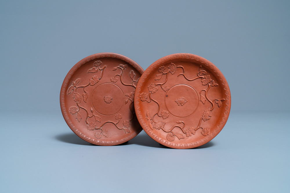 A pair of Chinese Yixing stoneware dishes with applied design, Kangxi