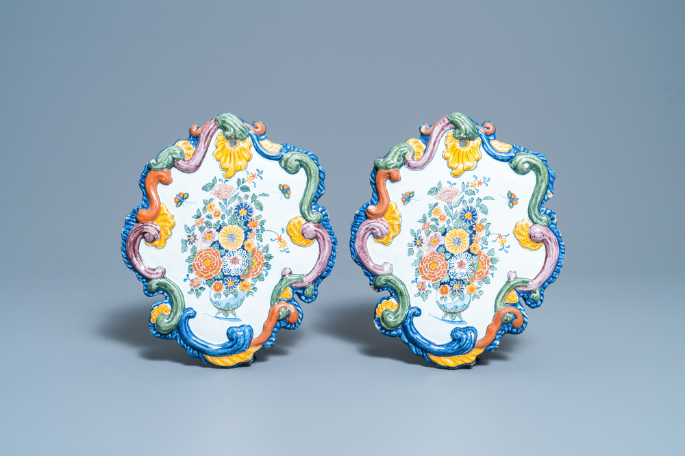 A pair of fine polychrome Dutch Delft plaques with still lifes of flowers in a vase, 18th C.