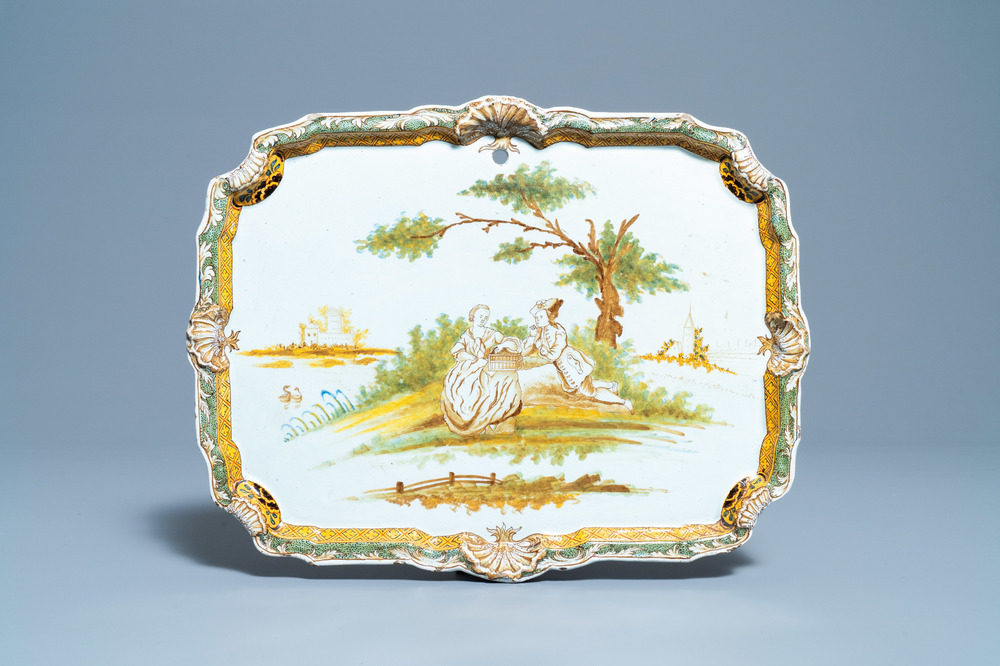 A polychrome Dutch Delft plaque with a pastoral scene in brown, green and yellow, 18th C.