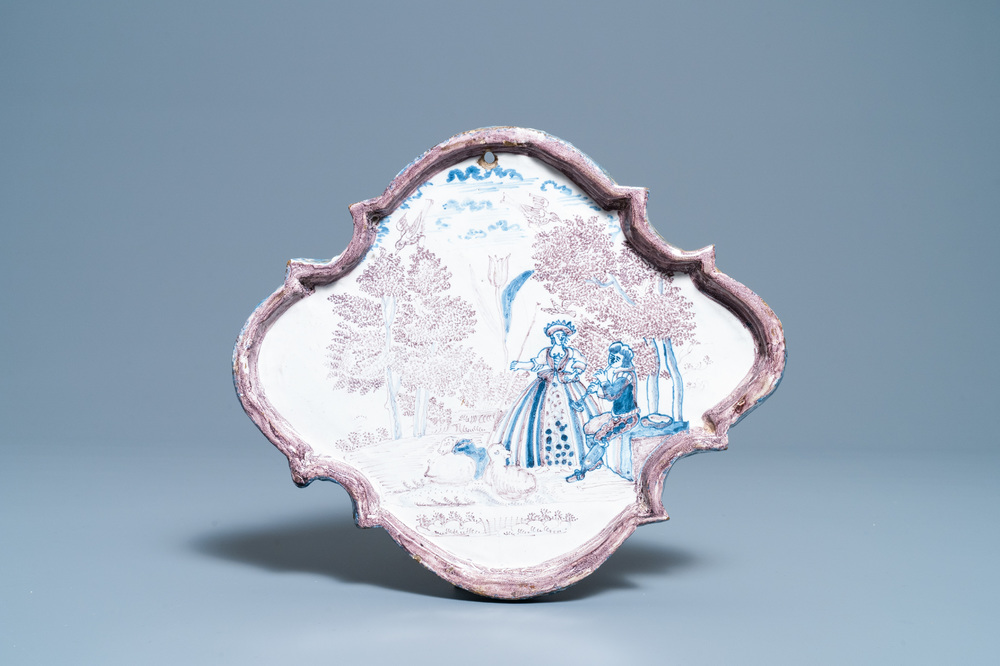 A blue and manganese Dutch Delft 'pastoral scene' plaque, 18th C.