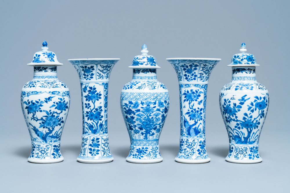 A Chinese blue and white garniture of five vases, Kangxi